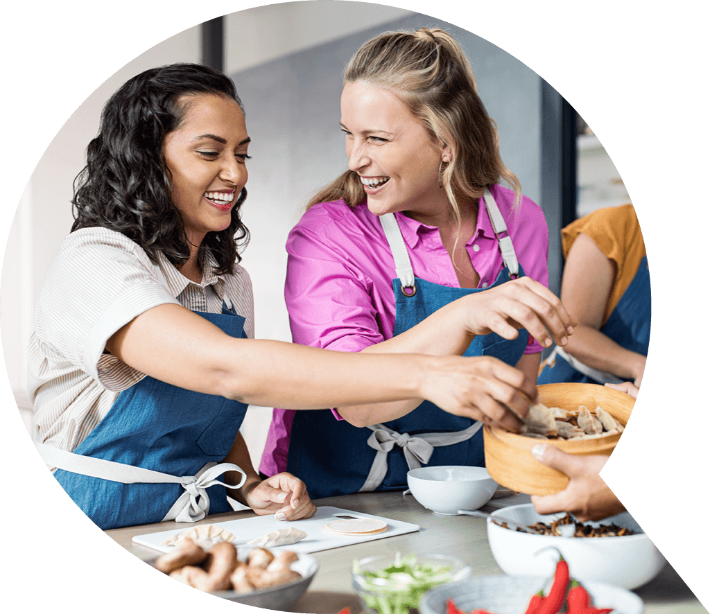 Two women cooking.